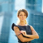 young businesswoman over office background
